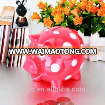 plastic piggy bank with dots